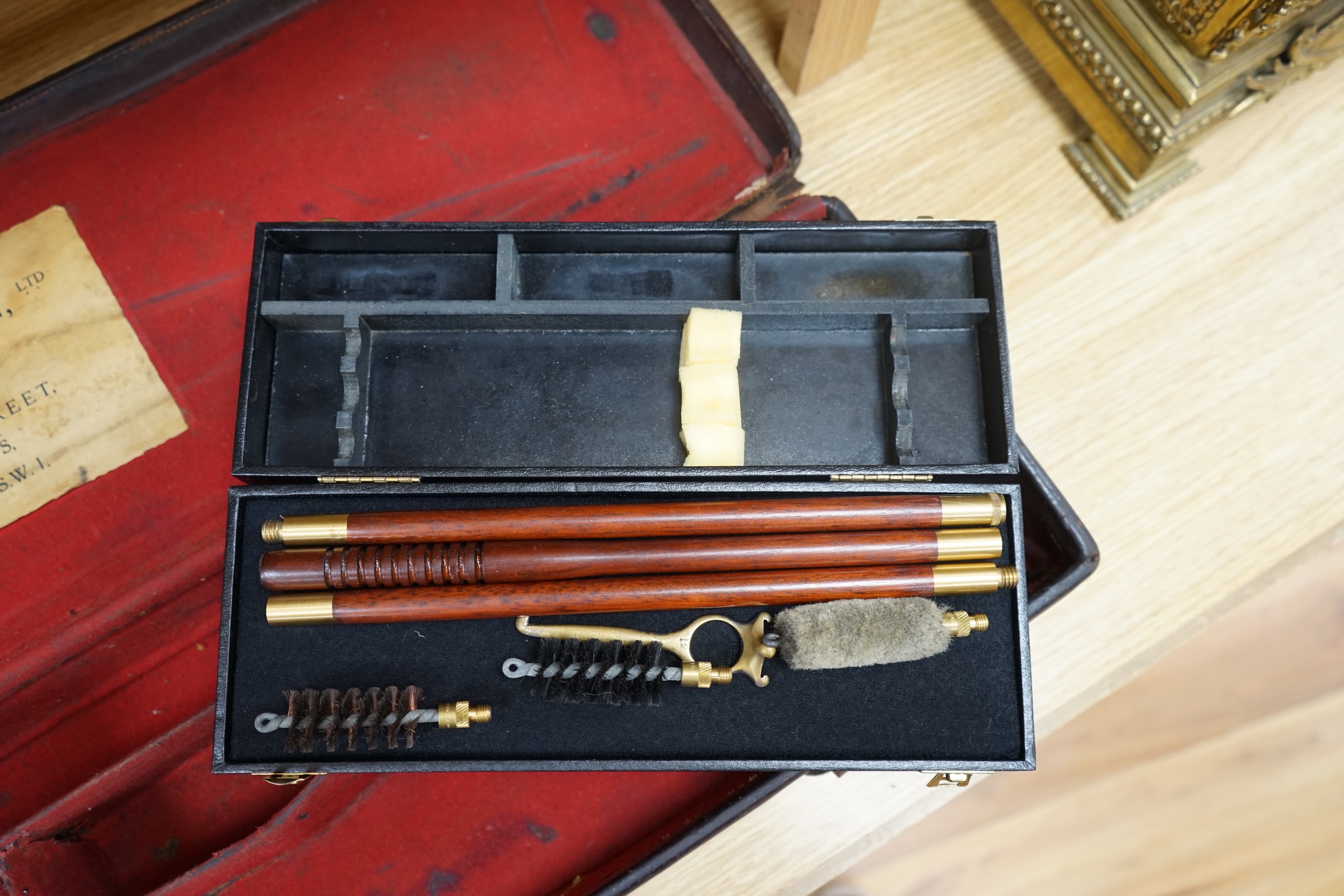 Two cases of gun cleaning equipment and a 19th century leather gun case, 83cm long. Condition - fair to good